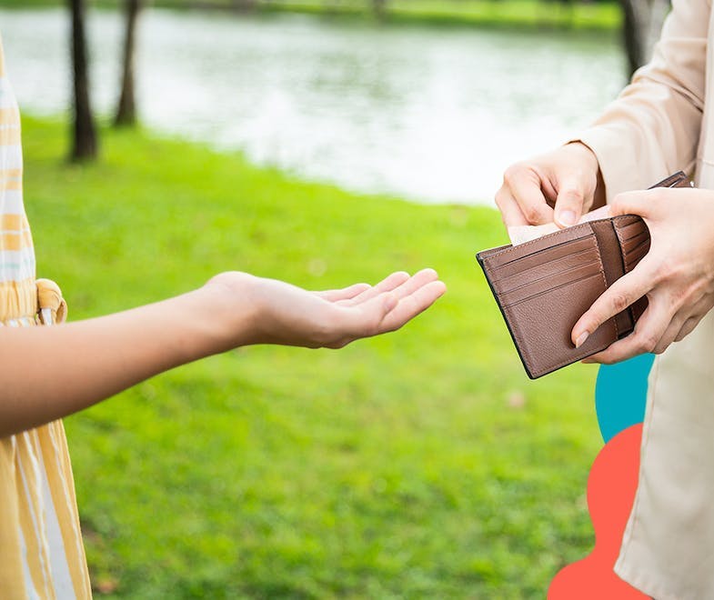 Person handing money from a wallet to another person to represent a tax relief