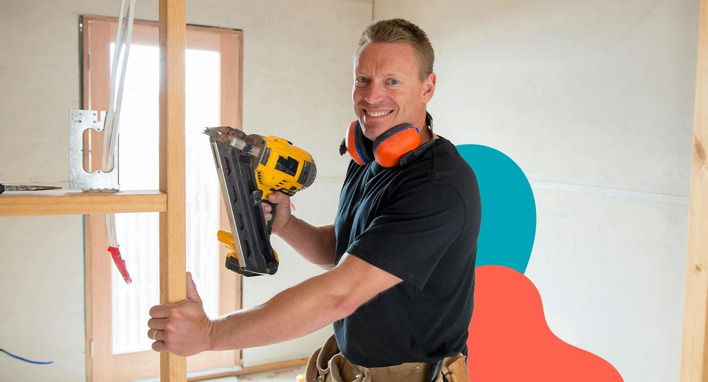 A man working as a builder inside a house, representing that builders can work as either a contractor or employee