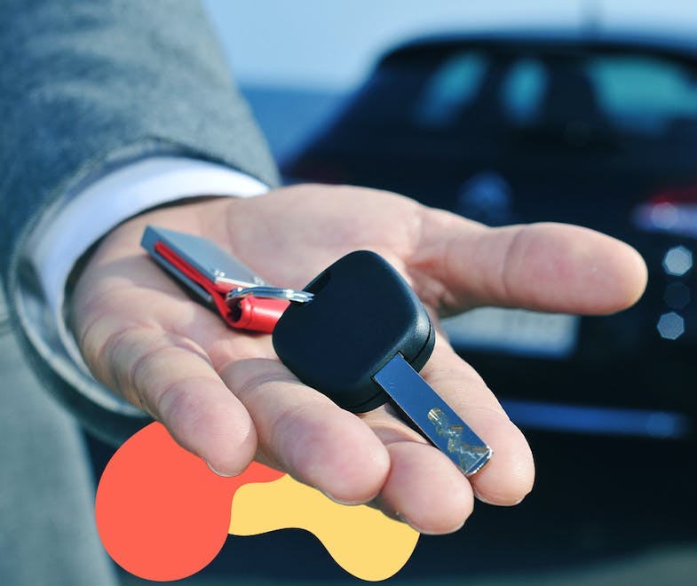 Hand holding a set of car keys